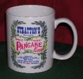 Coffee cup with Stratton's Self-Rising Whole Wheat Pancake Flour sack design.