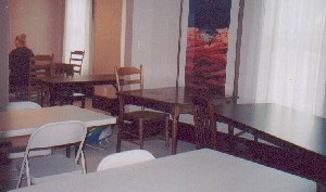 Tables set up for a scrapbooking weekend; view looking into the dining room. 