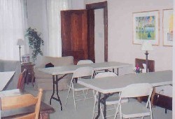 Tables set up for a scrapbooking weekend; view of the sitting room. 